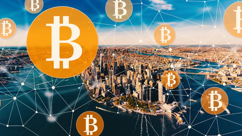 New York City in the background, with interconnected bitcoin symbols in the front.